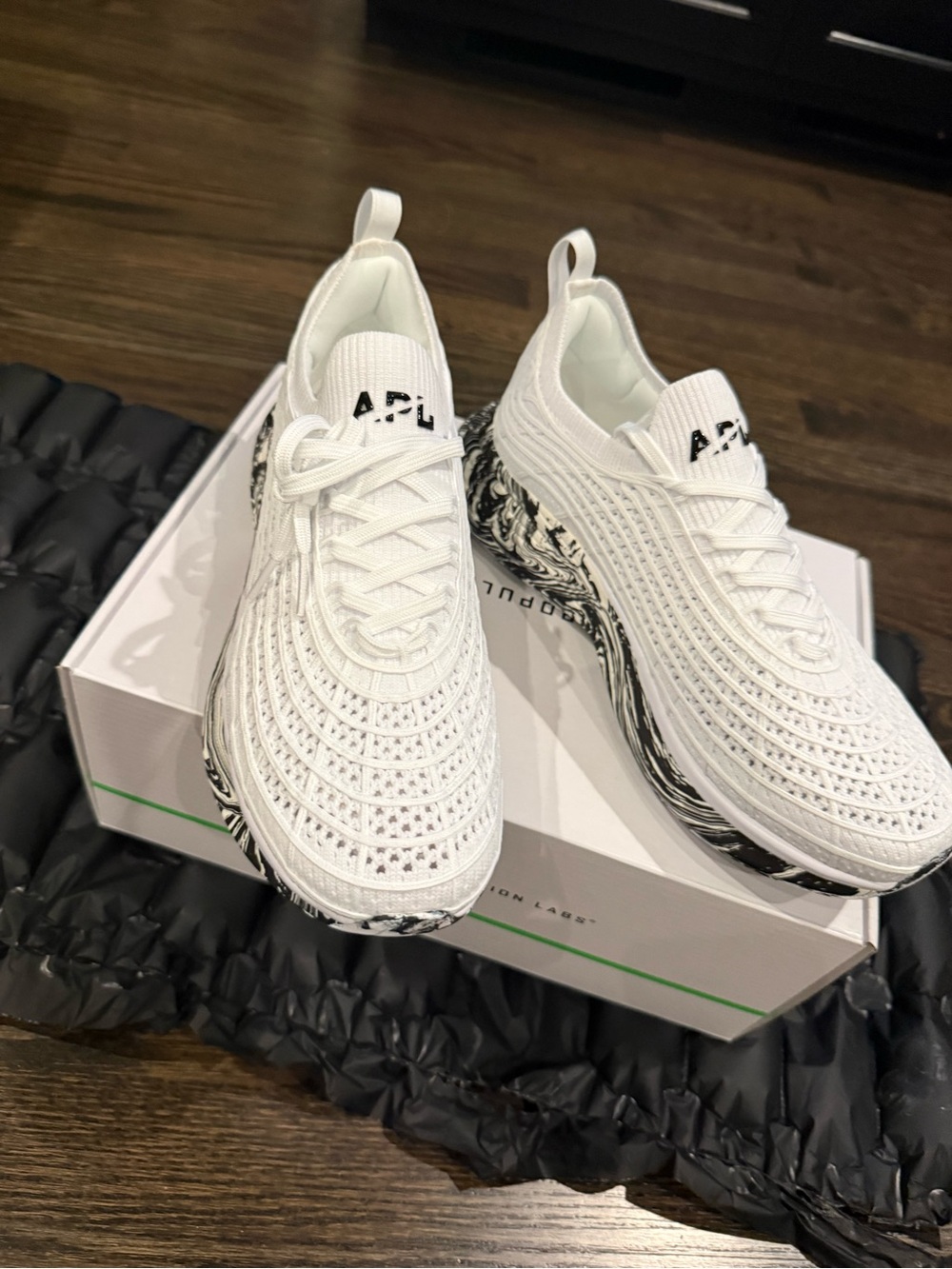 APL Women’s Techloom Zipline White Knit Athletic Sneakers with Black Marble Sole